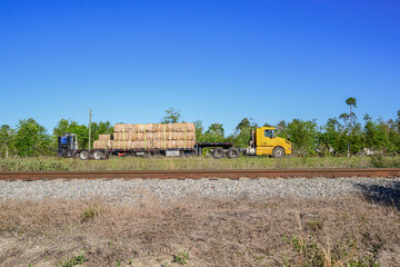 A tractor-trailer hauling recycled cardboard headed north on highway