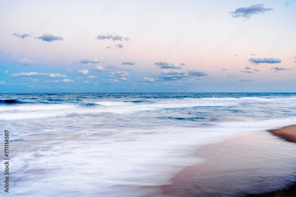 Wall mural long exposure of waves crashing on beach