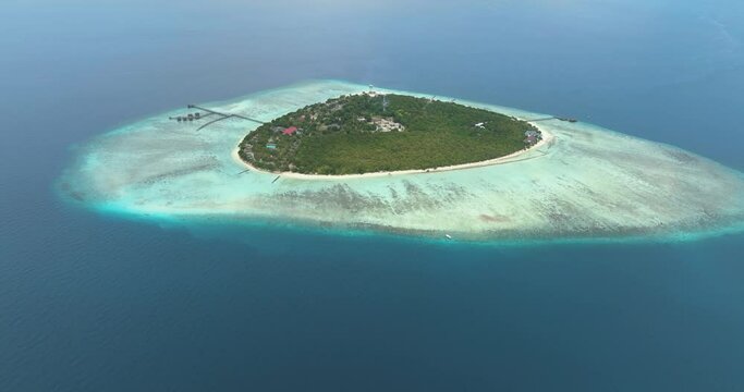Top view of island with beach and coral reef in the tropics. Pom Pom islet. Tun Sakaran Marine Park. Borneo, Sabah, Malaysia.