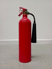 Obraz premium fire extinguisher in the work environment | bright background