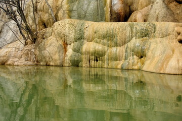 Tavertine stone with algae growing on it above a pool at Hierve el Agua in Oaxaca, Mexico