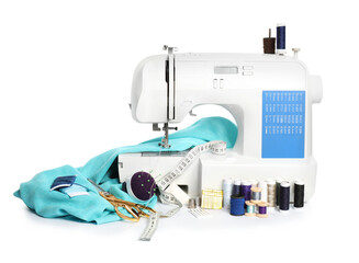 Modern sewing machine with light blue cloth and craft accessories isolated on white