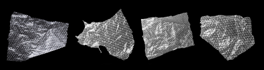 Transparent bubble wraps on black background, top view