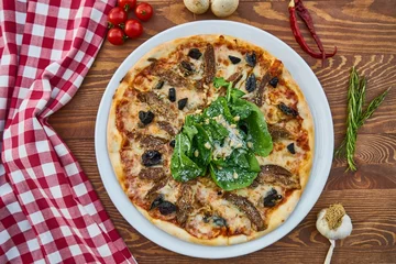 Fototapeten Pizza with mushrooms and cheese is a savory delight, featuring a crispy crust topped with tangy tomato sauce, earthy mushrooms, and melted cheese, creating a flavorful and satisfying combination. © MINHLAM