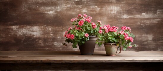 Two houseplants are displayed in flowerpots on a wooden table, adding a touch of nature to the rooms decor