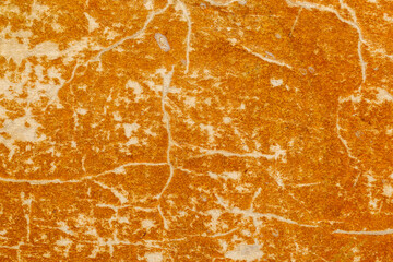 The image is of a wall with a brown and white texture