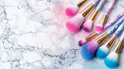 Blank mockup of a set of makeup brushes with colorful ombre bristles and a marble print handle perfect for a trendy and Instagramworthy look.