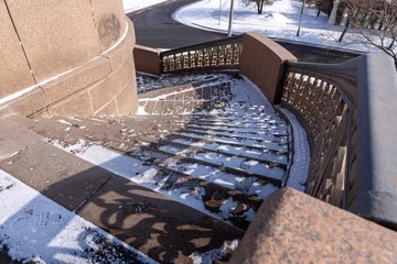 Foto op Plexiglas Helix Bridge granite spiral street staircase from a road bridge 
