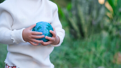 Adult person holding world globe, a healthy ecology to a new generation. Healthy ecology of the...