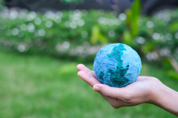 Adult person holding world globe, a healthy ecology to a new generation. Healthy ecology of the...