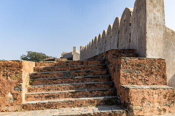 Fototapeta premium ancient fort wall ruins with bright sky from different perspective at morning