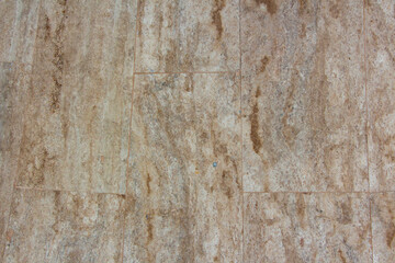 Old tile floor texture background. Close-up image of old stone floor