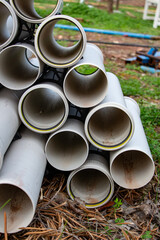 Close up of plastic pipes for water supply system in the garden. Plastic pipes for the construction of the house.