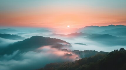 Foggy mountain tops at sunrise, dreamy landscape