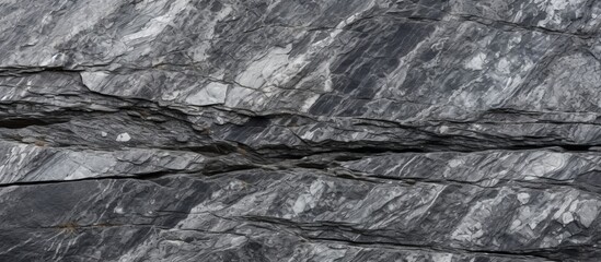 Obraz premium A close up of bedrock with a textured grey and white formation, creating a stunning landscape on the mountain slope