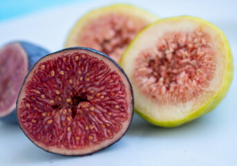 Ripe delicious red and green figs on a white background, selective focus