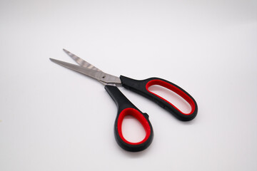 Shining scissors on white background