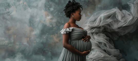 Beautiful pregnant black woman in grey dress caressing her big baby bump