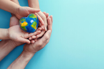 hands holding globe earth day - obrazy, fototapety, plakaty
