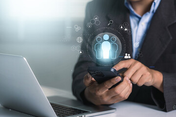 Human resource management, HR, recruitment, leadership and team building. Businessman holding on virtual screen with customer service and support team for quality.