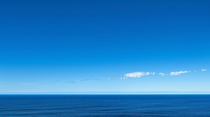 Obraz premium Blue horizon where the cloudless sky and the blue sea converge.