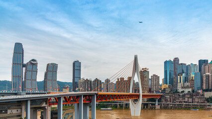 The Qiansimen Bridge, the Yangtze River Bridge in Chongqing, China, features vehicles driving on...