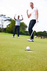 Happy man, friends and golfer with winner for goal in hole on the green grass or outdoor field in nature. Male person or people in celebration on golf course for winning, victory or ball on target