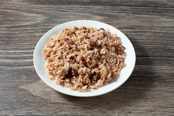 A view of a plate of rice and peas.