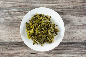 A top down view of a saucer of callaloo.