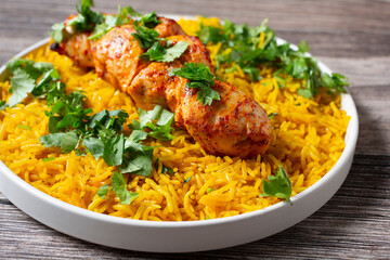 A view of a chicken kabob plate.
