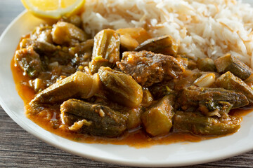 A closeup view of a plate of khoresh bamieh.