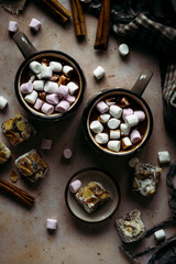 Obraz na płótnie Canvas Marshmallows dipped in hot chocolate flat lay Christmas food photography