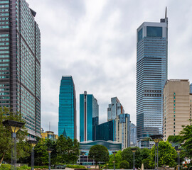 Obraz premium Looking up at the towering skyscrapers in the city center, in Chongqing, China