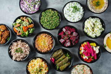 A top down view of a group of Mediterranean side dishes.