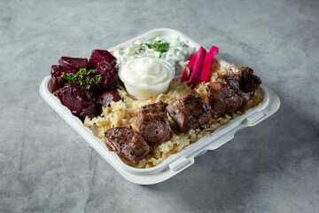 A view of a lamb kebab entree.