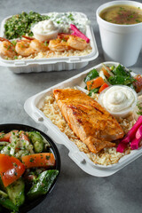 A view of several Mediterranean entrees.