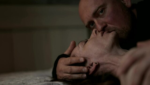 Portrait of a couple in love, where a man expresses his care and tenderness by caressing a woman's face, which conveys the atmosphere of their love and respect.