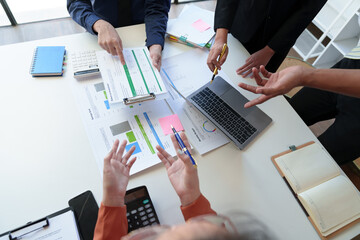 Team work process Business team use calculator to calculate figures, business statistics, profit,...