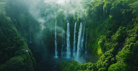  Waterfall in bali, waterfall with green plants and water flow from the top to bottom © Kien