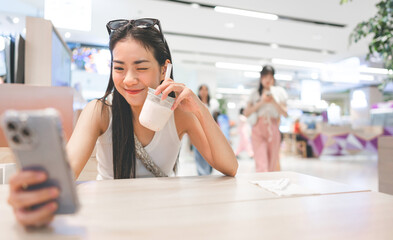 Southeast asian teenager woman using smartphone connect with people via internet modern lifestyle