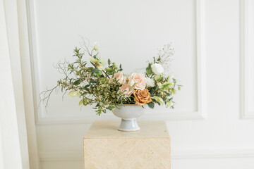 Chic flower arrangement on a modern pedestal