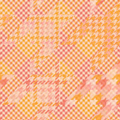 Tweed plaid pattern in orange, beige, pink. Seamless background textured houndstooth tartan check  print for dress, jacket, trousers, scarf, other modern spring autumn winter fashion fabric  