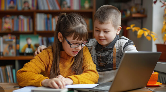 boy and girl with down syndrome using computer, inclusion, diversity
