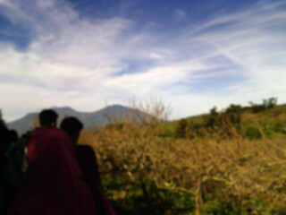Naklejka na ściany i meble blurred photos of people walking in the mountain