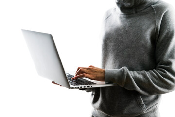 A person in a gray hoodie using a laptop, photographed against a white background, illustrating the...