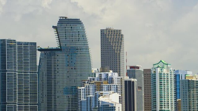 Miami Brickell in Florida, USA. Concrete and glass skyscraper buildings in downtown district. American megapolis with business financial district on sunny day
