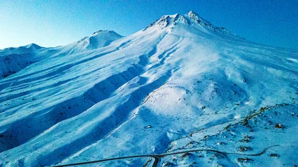 Fotobehang The scenic views of Hasan Mountain, which is a volcanic mountain with its 3268 meters peak, attracts the summit lovers with its majestic stance, Aksaray, Turkey © Selcuk