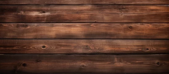 Tuinposter Close-up view of a wooden wall featuring a dark brown stain, creating a textured background for design projects © vxnaghiyev