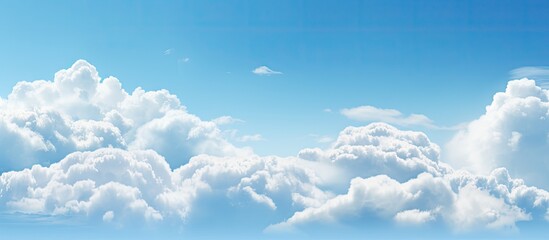 A commercial airplane is soaring high amidst the serene blue sky filled with fluffy white clouds,...