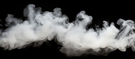 Swirling smoke is prominent in the atmosphere against a dark black background, creating a mysterious and captivating scene